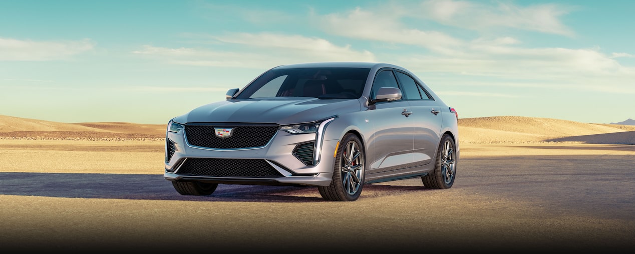 Three Quarters Front View of a Silver 2026 CT4 Parked in the Open Desert