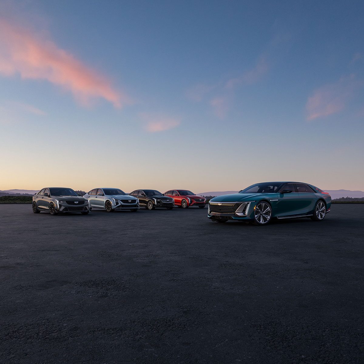 The Cadillac Sedan Line-up Parked in an Open Desert During Dusk