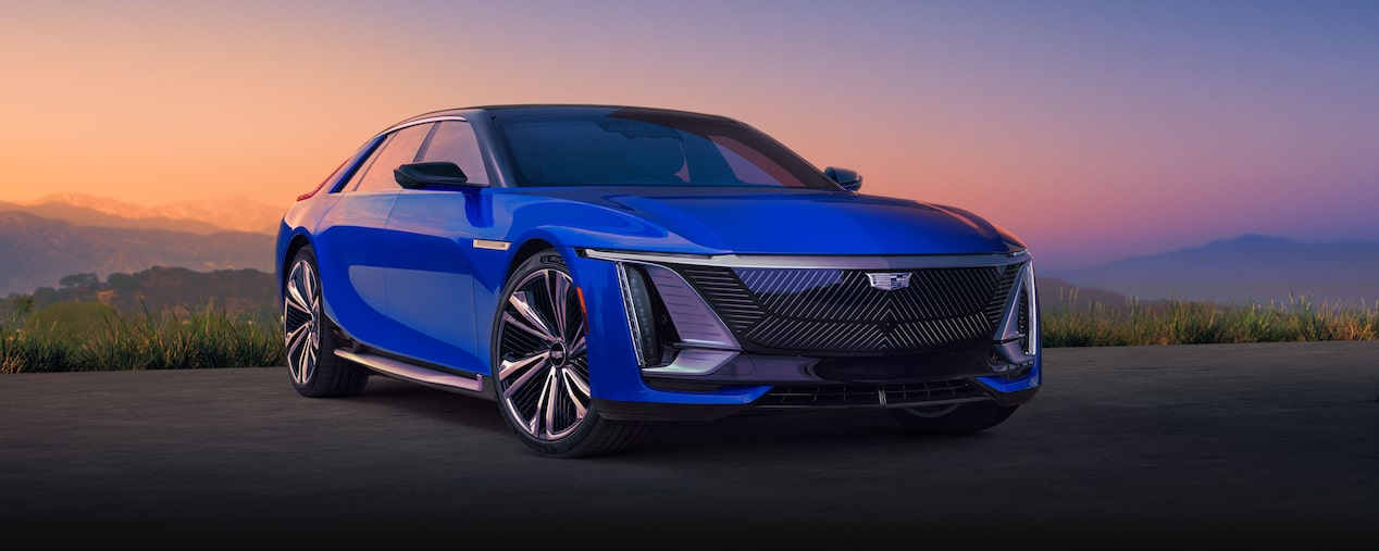 Three-quarter View of a Blue Cadillac CELESTIQ Under a Mountain Sunset