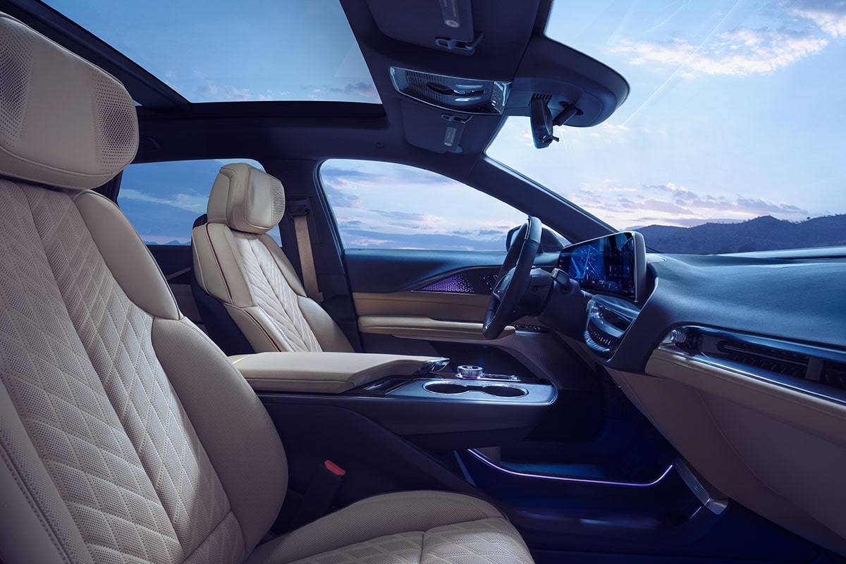 Passenger Seat View of the 2025 LYRIQ Front Row Cabin Overlooking the Mountains