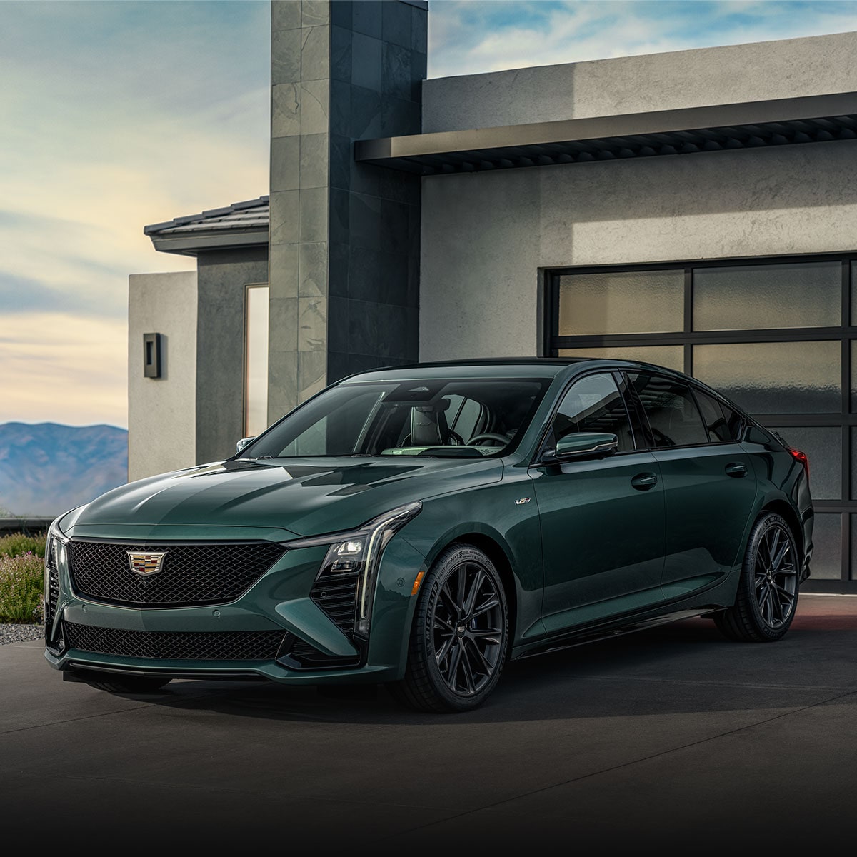 A Cadillac CT5-V Parked in Front of a Home Garage.