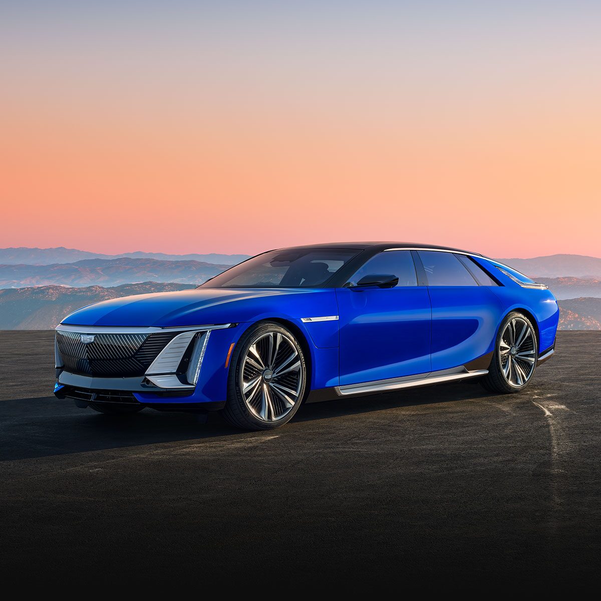 Three-quarter View of a Blue Ultra-luxury Cadillac CELESTIQ Parked Under a Mountain Sunset